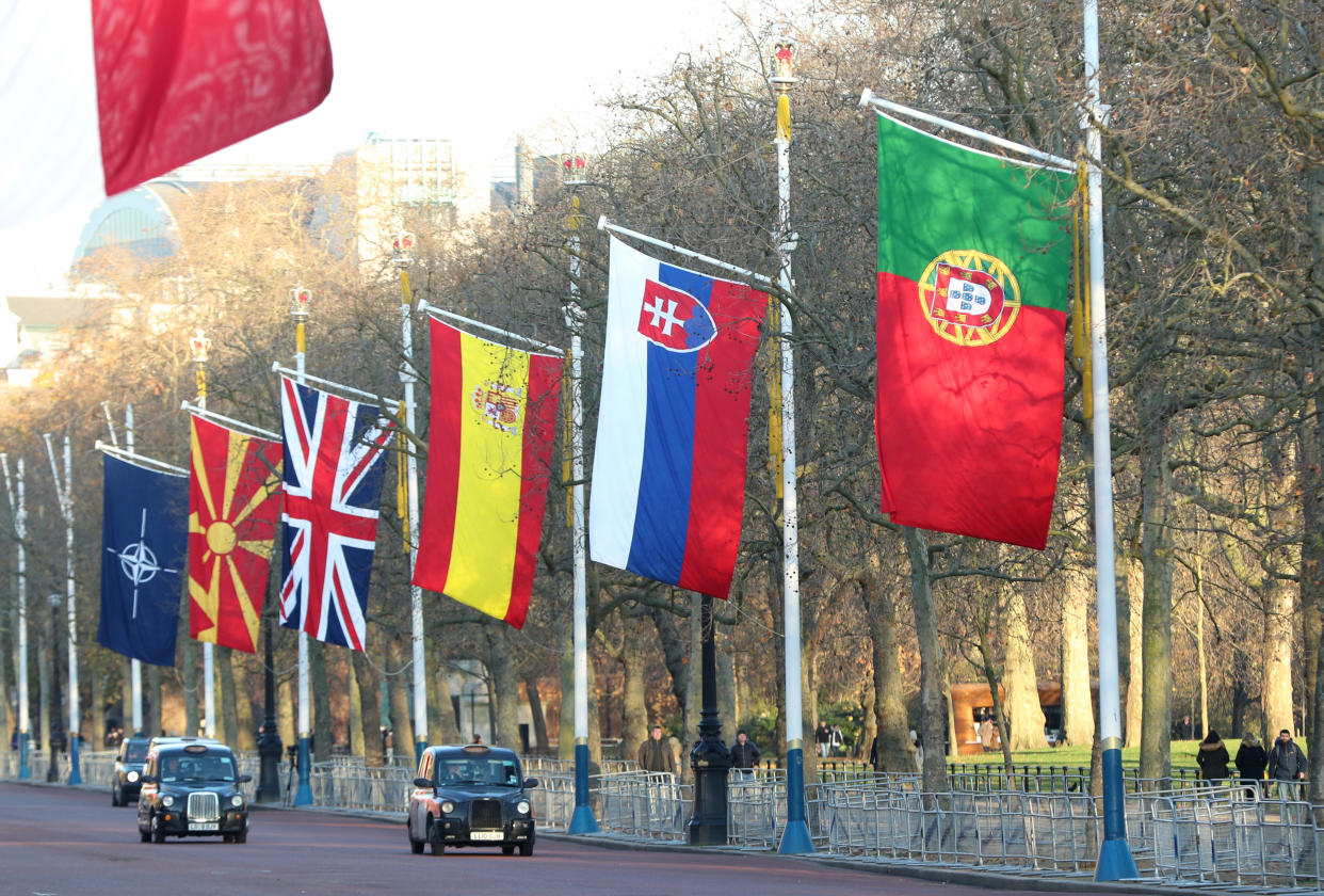 London taxis drive past NATO and members' flags ahead of Nato Summit in London, Britain December 2, 2019 REUTERS/Yves Herman