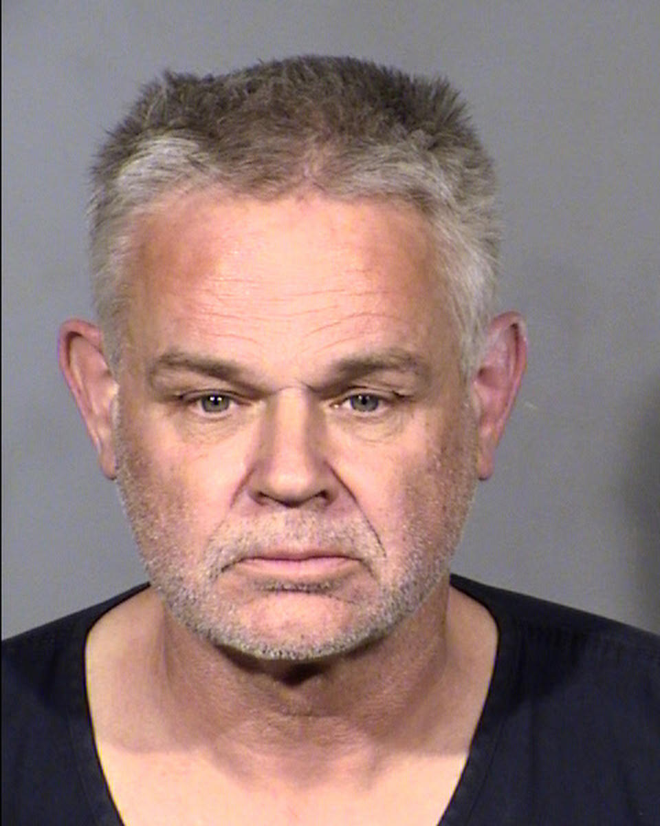 FILE - This Clark County, Nev., Detention Center photo provided by the Las Vegas Metropolitan Police shows Eric Holland, following his arrest on Dec. 23, 2021, in Las Vegas. Holland, as 58-year-old ex-convict was sentenced Thursday to 18 to 45 years in prison for killing and dismembering a man whose severed head was found by police in a stolen pickup truck he was driving about a year ago in Las Vegas. Holland declared himself truly remorseful about the shooting death of his friend, Richard P. Miller. (Las Vegas Metropolitan Police Department via AP, File)