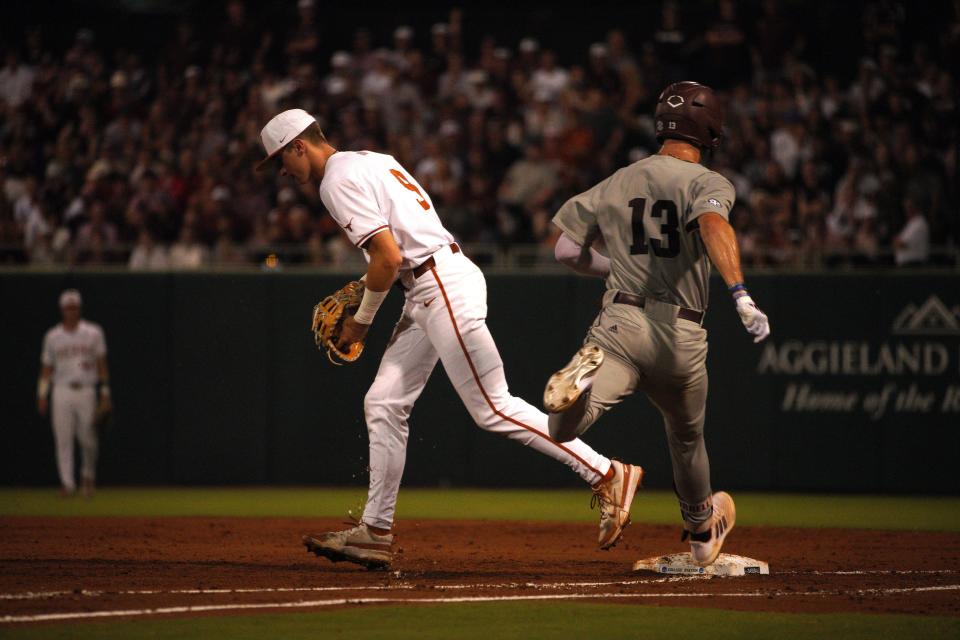 Texas Longhorns infielder Jared Thomas (9) forces out Texas A&M Aggies outfielder Caden Sorrell (13) during the second round in the NCAA baseball College Station Regional at Olsen Field College Station.