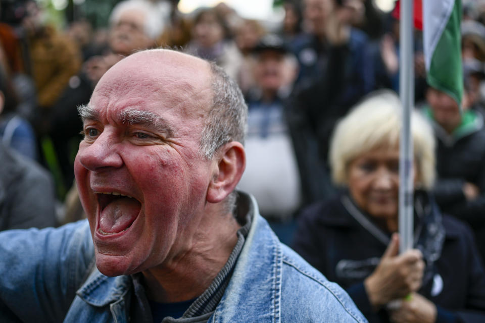 A man shouts slogans during protest outside the Hungarian Interior Ministry building to demand stronger protections for children and Interior minister Sandor Pinter to step down, in Budapest, Hungary, Friday, April 26, 2024. Peter Magyar, a former insider within Orban's ruling Fidesz party, lead a protest. The demonstration was the latest in a series of large anti-government protests that Magyar has mobilized in recent weeks, and comes as the political newcomer is campaigning for EU elections this June with his new party, Respect and Freedom (TISZA). (AP Photo/Denes Erdos)