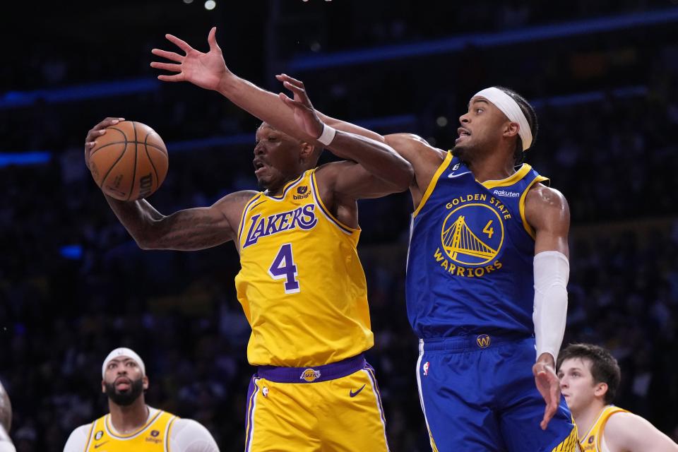 Lakers guard Lonnie Walker IV and Warriors guard Moses Moody battle for the ball in the second half of Game 4.