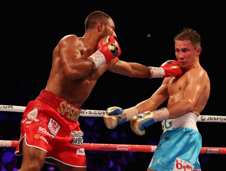 Kell Brook (L) fires a left hand at Gennady Golovkin during their middleweight title fight in London on Saturday. Golovkin won by fifth-round stoppage. (Getty Images)