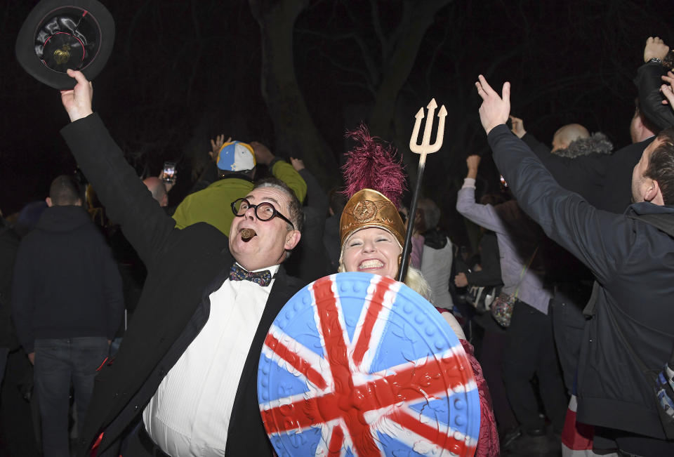 A Brexit supporter celebrates during a rally in Parliament square in London, England as Britain left the European Union on Friday, Jan. 31, 2020. Britain officially leaves the European Union on Friday after a debilitating political period that has bitterly divided the nation since the 2016 Brexit referendum. (AP Photo/Alberto Pezzali)