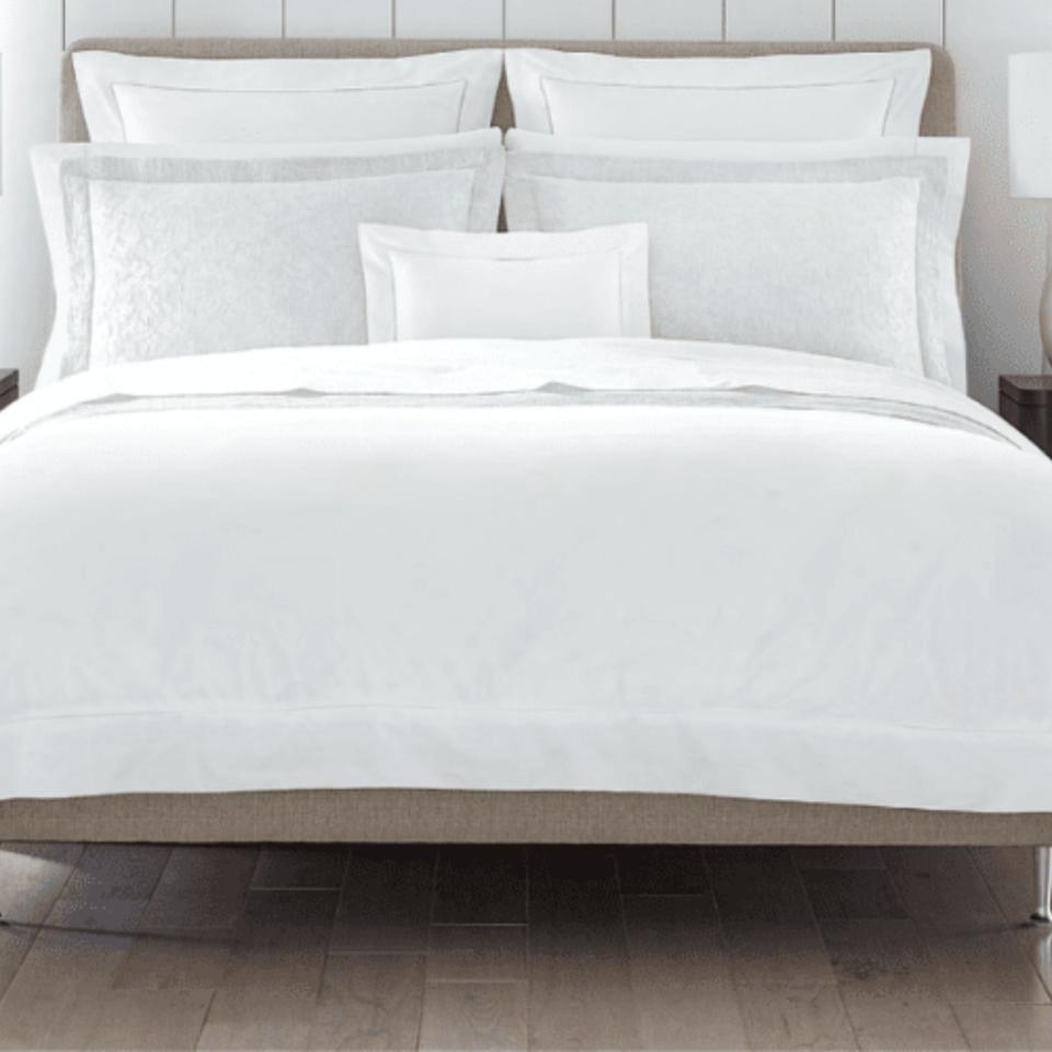 Sferra Celeste Linens on a bed.