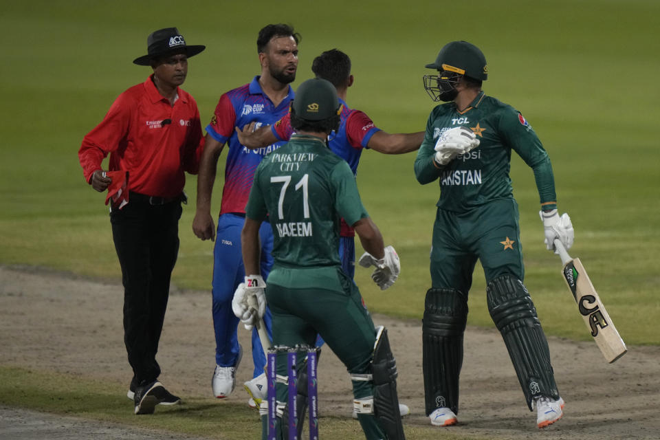 Afghanistan's Fareed Ahmad, second left, and Pakistan's Asif Ali, right, react after Ali was dismissed by Ahmad during the T20 cricket match of Asia Cup between Pakistan and Afghanistan, in Sharjah, United Arab Emirates, Wednesday, Sept. 7, 2022. (AP Photo/Anjum Naveed)