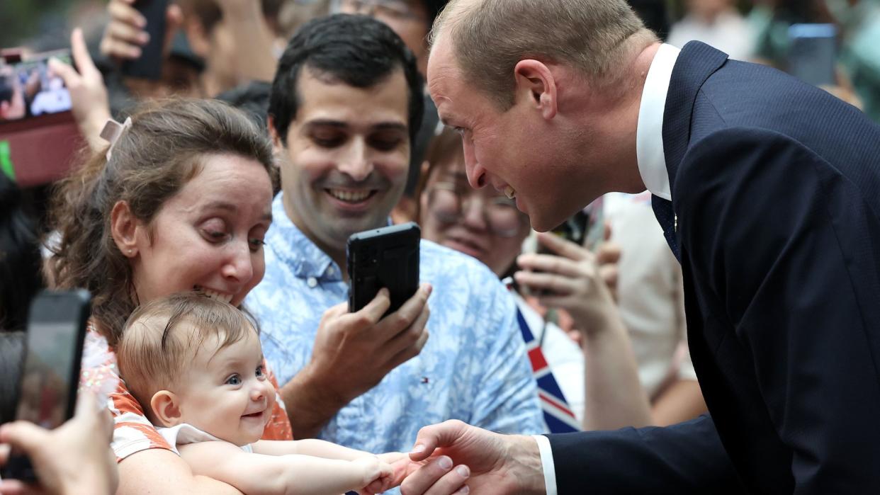  Prince William baby biting his finger. 