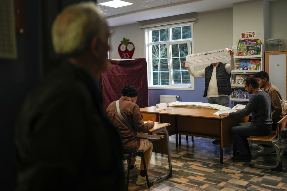 Election representatives count the ballots at a polling station in Istanbul, Turkey, Sunday, March 31, 2024. Turkey on Monday was coming to grips with the opposition's unexpected success in local elections that saw it outperform President Recep Tayyip Erdogan's ruling party and add to municipalities gained five years ago. (AP Photo/Emrah Gurel)