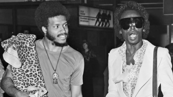 This photo from July 1973 shows American musician James Mtume (left) and iconic jazz trumpeter Miles Davis arriving at Heathrow Airport in London. (Photo: R. Brigden/Express/Hulton Archive/Getty Images)