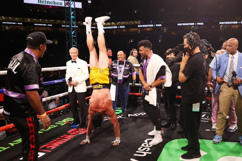 Logan Paul does a hand stand after his contracted exhibition boxing match against Floyd Mayweather