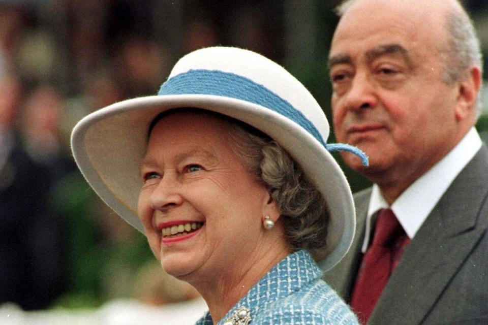 The late Queen Elizabeth II accompanied by the then-owner of Harrods, Mohamed Al-Fayed, at the Royal Windsor Horse Show in 1997 (PA)