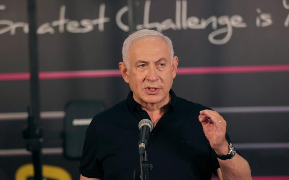 Prime Minister Benjamin Netanyahu talks to the media during a visit to the Fitness gym ahead of the re-opening of the branch in Petah Tikva, Israel - Tal Shahar, Yediot Ahronot/AP Photo
