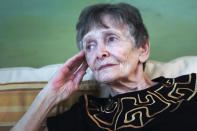 Ellen Ensig-Brodsky, 89, a LGBTQ rights activist, pose in her home, Wednesday, June 22, 2022, in New York. Even with ailing knees, Ensig-Brodsky said she plans to be on the Pride Parade route on Sunday. "The parade is the display, publicly, of my identity." (AP Photo/Bebeto Matthews)