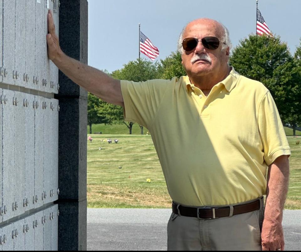 Richard Thomas, the nephew and godson of World War II soldier George "Bud" Thomas, stands alongside the columbarium site where his uncle's remains now rest at the Rhode Island Veterans Memorial Cemetery in Exeter.