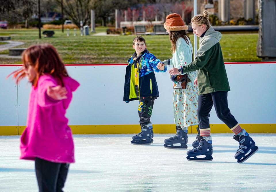 Guests ice skate at Holiday Park on Black Friday, Nov. 24, 2023, in Indianapolis.