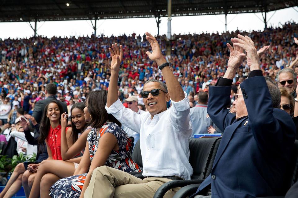 During an exhibition baseball game between the Tampa Bay Rays and the Cuban National Team in Havana, Cuba, Obama and President Ra&uacute;l Castro of Cuba spontaneously join in "the wave" that others in the crowd had started on March 22.