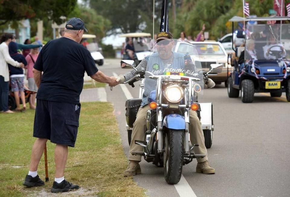 Terry Longpre pulls over to shake a man’s hand during Anna Maria Island’s 2017 “Old Soldiers and Sailors” parade to honor Veterans Friday.