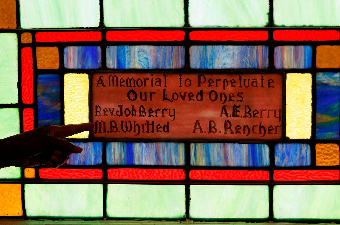 Retired Judge Beverly Scarlett points out the details of stained-glass windows at Dickerson Chapel AME Church on Thursday, April 18, 2024, in Hillsborough, N.C. Kaitlin McKeown/kmckeown@newsobserver.com