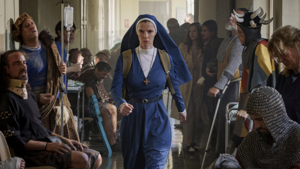 MRS. DAVIS -- "TBD" Episode 104 --Pictured: Betty Gilpin as Simone -- (Photo by: Sophie Kohler/PEACOCK)