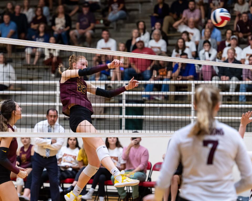 Dripping Springs' Henley Anderson follows through on a spike during the Tigers' three-set sweep of Round Rock in the Class 6A regional quarterfinals last season at Burger Center. The Tigers went on to win the Class 6A state title and return a loaded team, including Anderson, the co-Central Texas player of the year.