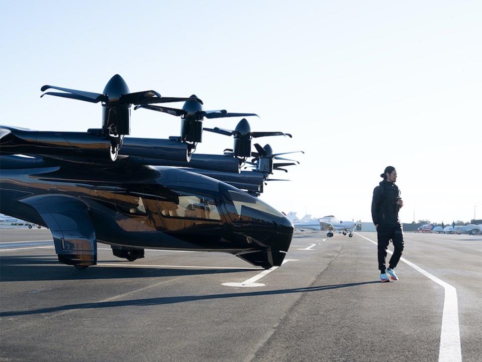 Archer's Midnight eVTOL with a person walking next to it.