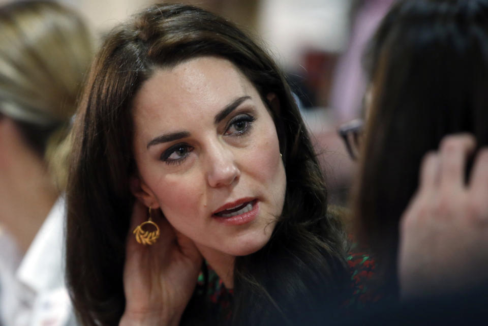 Britain's Kate, The Duchess of Cambridge, smiles and gestures as she talks to staff and young people, during a visit a visit to The Mix in London, December 19, 2016. REUTERS/Alastair Grant/Pool