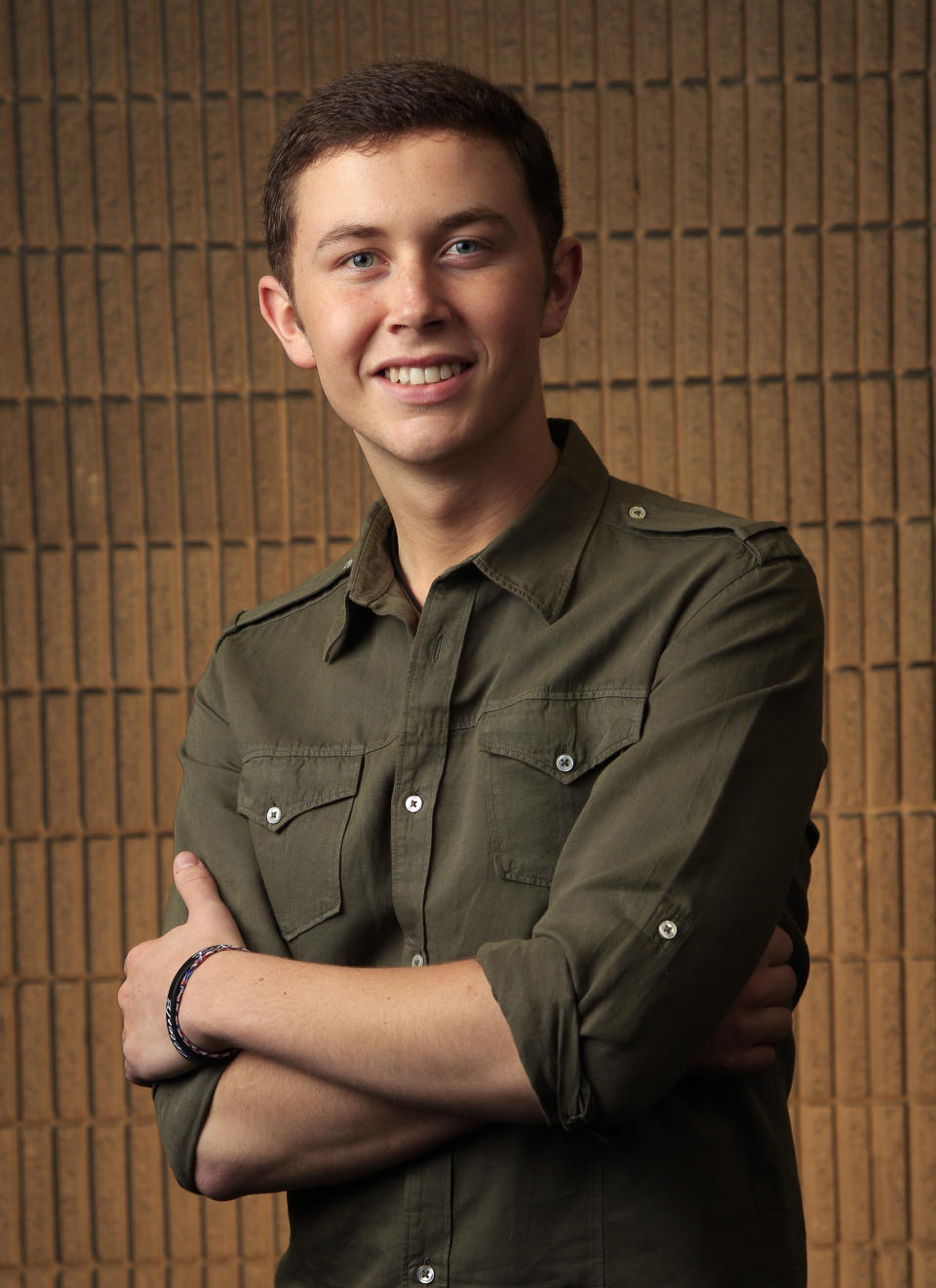 This March 8, 2012 photo shows Scotty McCreery in Nashville, Tenn. McCreery is one of several male performers included in the fan-voted top new artist category at the Academy of Country Music Awards. (AP Photo/Mark Humphrey)