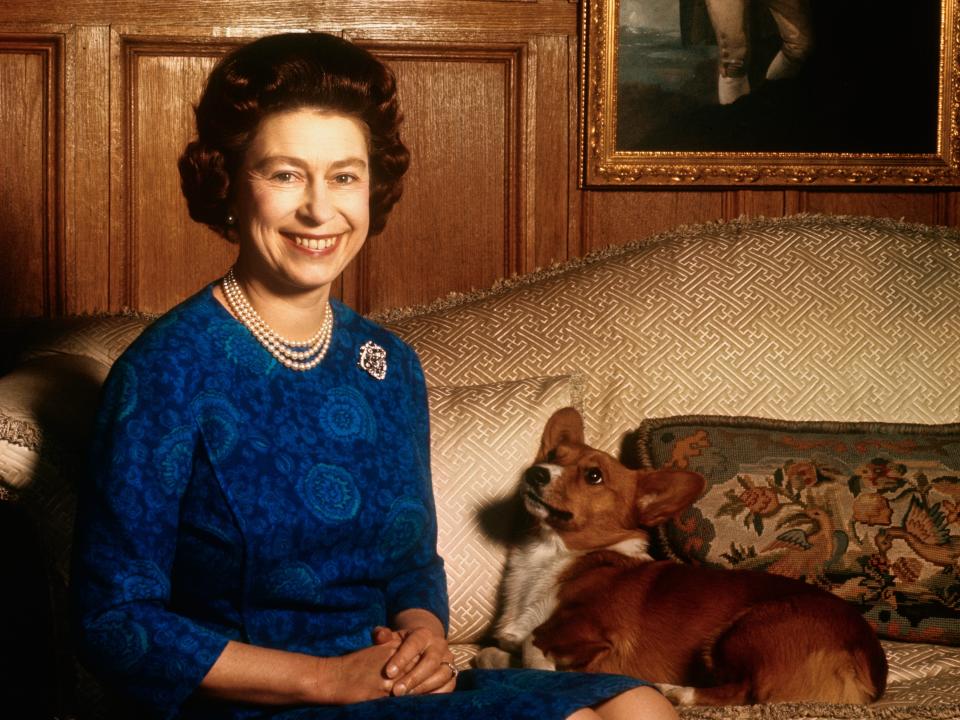 Queen Elizabeth posing with a corgi on February 04, 1970.