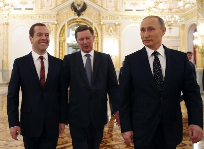 Russian President Vladimir Putin (R), walks with Prime Minister Dmitry Medvedev (L) and Kremlin chief of staff Sergei Ivanov on December 3, 2015 (AFP Photo/Dmitry Astakhov)