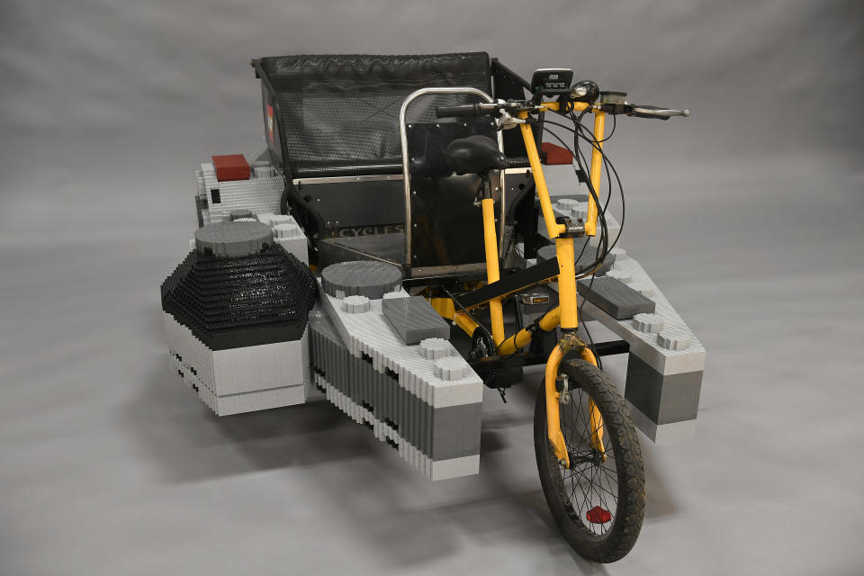 This is the Lego <em>Millennium Falcon</em> pedicab you’re looking for. (Photo: Jessica Hill/AP Images for Lego, Inc)