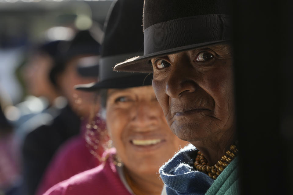 Voters line up at a polling station during a runoff presidential election in Cangahua, Ecuador, Sunday, Oct. 15, 2023. (AP Photo/Dolores Ochoa)