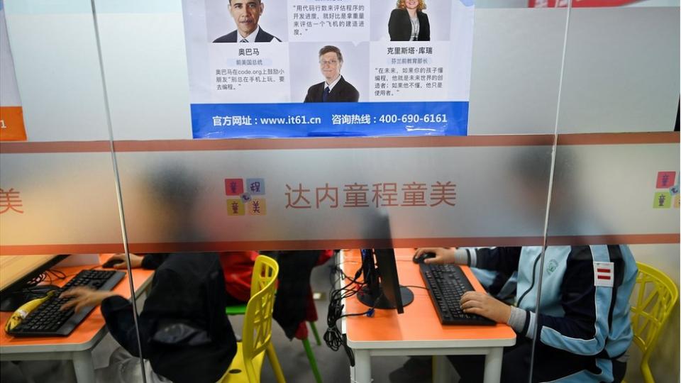 This picture taken on November 8, 2019 shows pupils attending a class at a children's computer coding training centre in Beijing. - China has been making huge investments in robotics and Artificial Intelligence (AI), with the government issuing in 2017 an AI development plan which suggested programming courses be taught in both primary and secondary schools