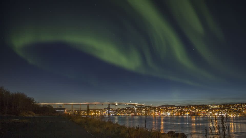 The northern lights shine over Tromso in October 2014. - Jan Morten Bjoernbakk/AP