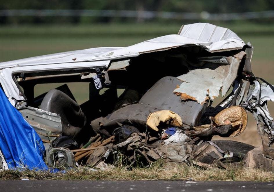 Straw hats, a backpack and tools can be seen in the wreckage of a three-vehicle crash Thursday that claimed the lives of seven farmworkers on Interstate 5 between Salem and Albany.