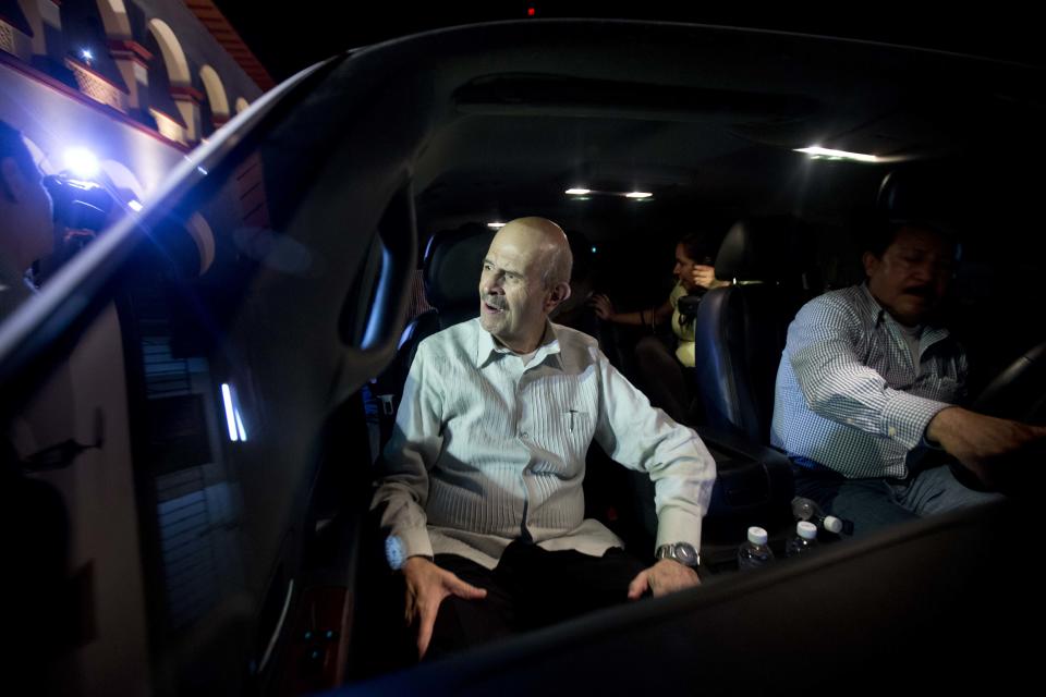 Michoacan state Gov. Fausto Vallejo is driven away after attending a meeting at City Hall in Apatzingan, Mexico, Tuesday, Jan. 14, 2014. Mexican soldiers and federal police kept a tense standoff with vigilantes Tuesday after a new government campaign to stop violence in the western Michoacan state turned deadly. A clash occurred as the government sent more troops to where the vigilantes have been fighting the Knights Templar cartel. Federal and state officials met late Tuesday with leaders of vigilante groups but failed to reach a disarmament agreement. (AP Photo/Eduardo Verdugo)