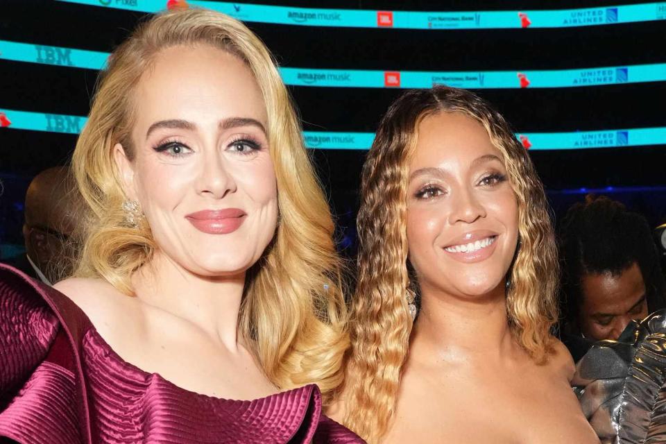 <p>Kevin Mazur/Getty </p> Adele and Beyoncé at the Grammys in Los Angeles in February 2023