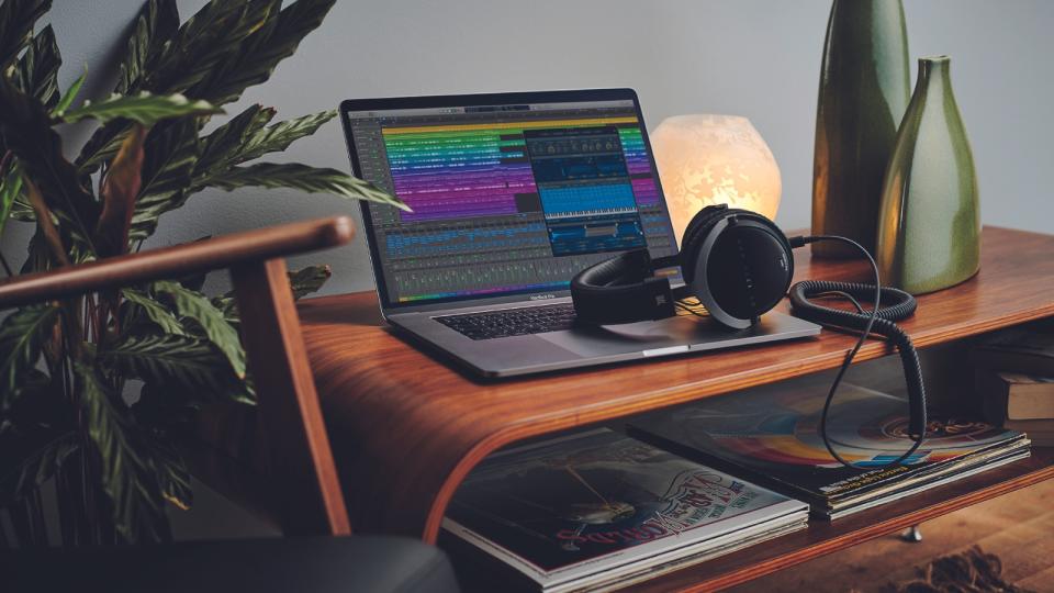 A MacBook with music making software displayed