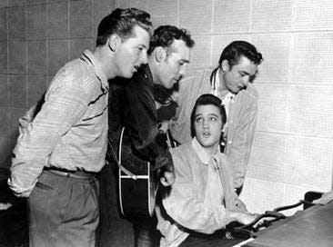 Jerry Lee Lewis, Carl Perkins, Johnny Cash, and (seated) Elvis Presley jammed at Sun Records in Memphis, Dec. 4, 1956. The sessions are known as the Million Dollar Quartet.