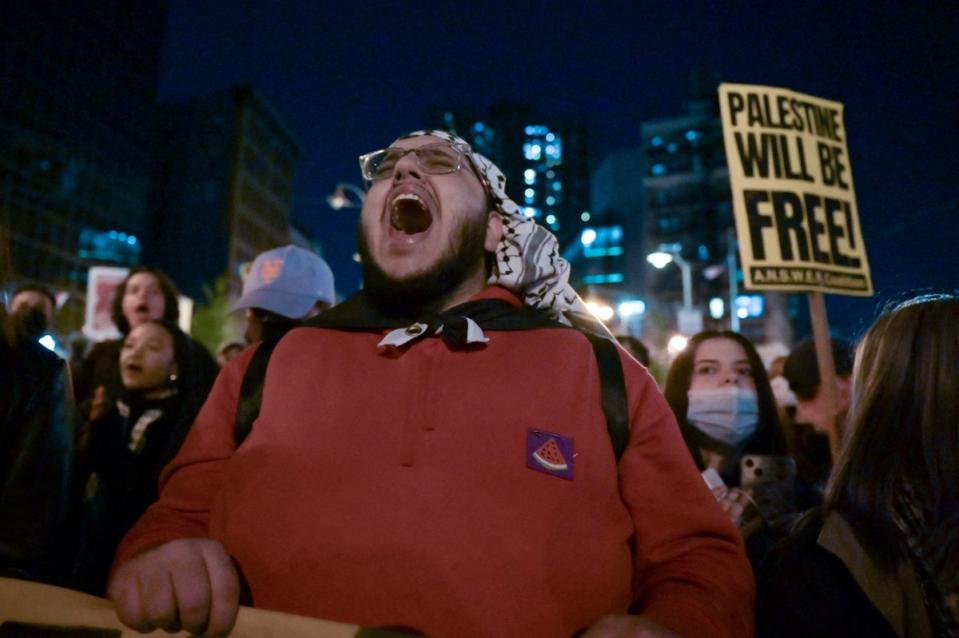 Protesters chant near city hall after attending an occupation at New York University (NYU) (REUTERS)