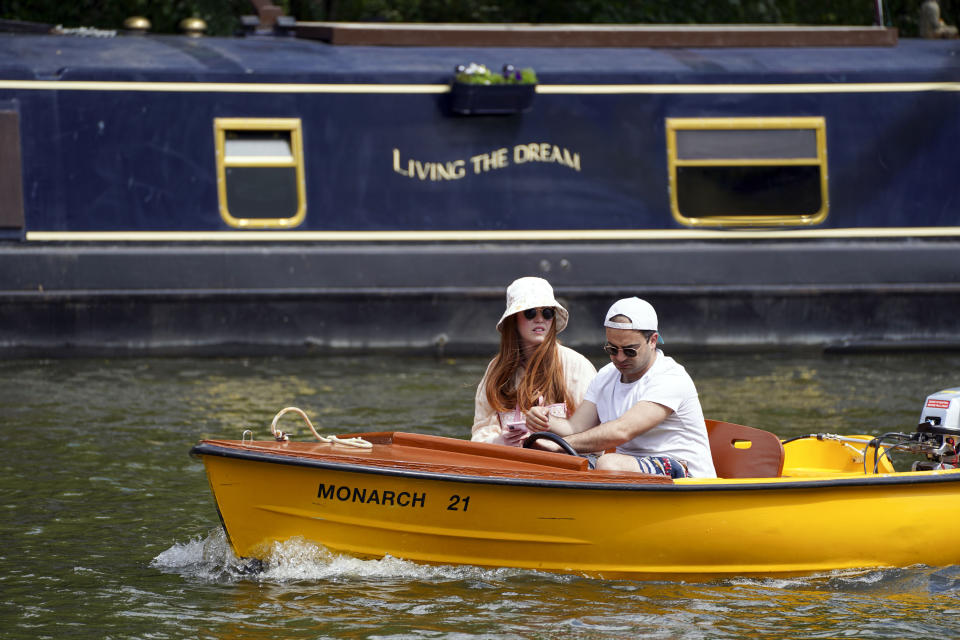 <p>People enjoy boats on the River Thames in Windsor, Berkshire. The UK has recorded its third successive warmest day of the year with temperatures reaching 26.6C in parts of the country. Picture date: Wednesday June 2, 2021.</p>
