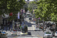 This photo shows a general view of Bourke Street as shoppers return to the precinct in Melbourne, Australia, Wednesday, Oct. 28, 2020. In Melbourne, Australia's former coronavirus hot spot, restaurants, cafes and bars were allowed to open and outdoor contact sports can resume Wednesday, emerging from a lockdown due to the coronavirus outbreak. (AP Photo/Asanka Brendon Ratnayake)