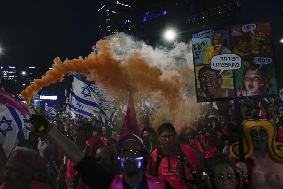 Israelis protest against plans by Prime Minister Benjamin Netanyahu's government to overhaul the judicial system, in Tel Aviv, Israel, Saturday, April 8, 2023. (AP Photo/Ariel Schalit)