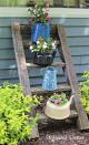 <p>Calling all tea lovers: This series of smaller container gardens on a rustic ladder is a nod to your favorite beverage. Now, all you need is an outdoor patio set next to it for tea time.</p><p><a rel="nofollow noopener" href="http://www.organizedclutter.net/2015/06/how-to-add-vertical-interest-to-flower.html" target="_blank" data-ylk="slk:See more at Organized Clutter »;elm:context_link;itc:0;sec:content-canvas" class="link "><em>See more at Organized Clutter »</em></a></p>
