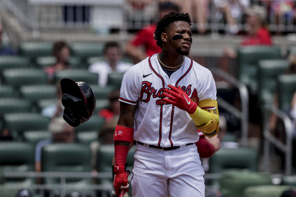 Atlanta Braves' Ronald Acuna Jr. reacts after striking out against the Los Angeles Angels during the third inning of a baseball game, Sunday, July 24, 2022, in Atlanta. (AP Photo/Butch Dill)