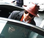 Kenichi Shinoda, boss of Japan's largest yakuza gang, the Yamaguchi-gumi, gets into a car on April 9, 2011 after his release from a Tokyo prison