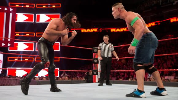 Seth Rollins and John Cena in a WWE ring