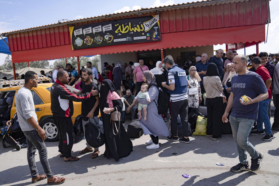 FILE - Palestinians wait to cross into Egypt at the Rafah border crossing in the Gaza Strip, Oct. 16, 2023. Former President Donald Trump and other top Republicans are issuing increasingly urgent calls for the U.S. to seal its borders against a potential mass exodus of Palestinians fleeing war in the Gaza Strip, suggesting that a surge in civilian refugees could allow potential extremists into the country. (AP Photo/Fatima Shbair, File)