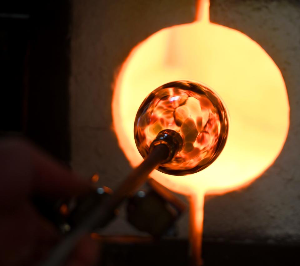 A globe art piece by artist Sebastian Shepherd is shown during a demonstration at The Glass Garden of Canton.