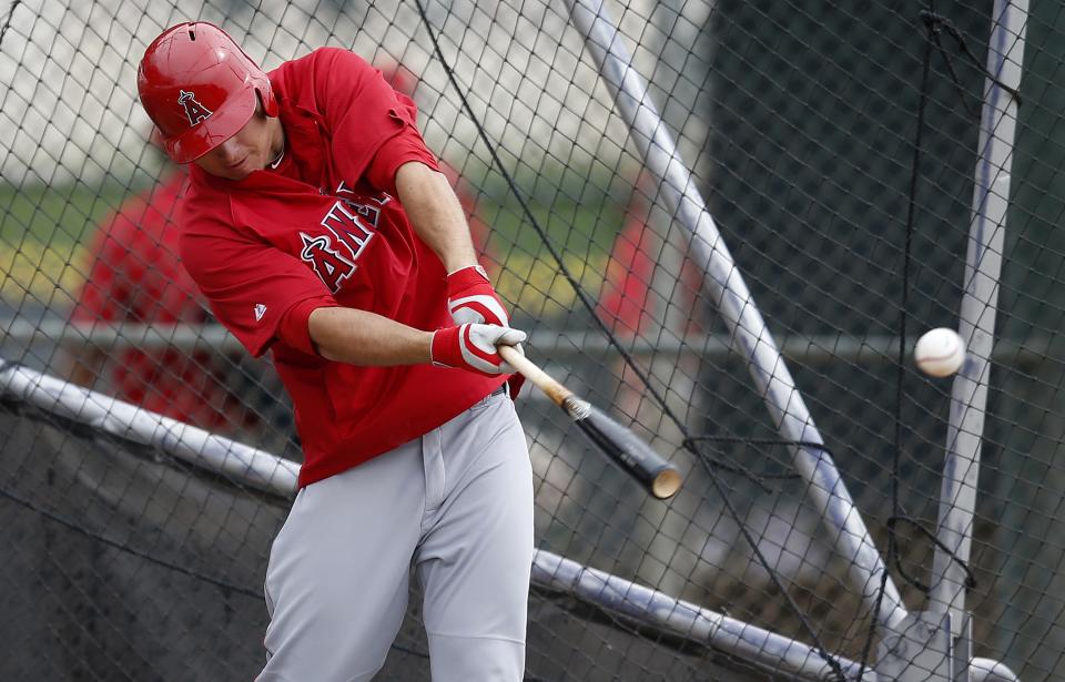 Los Angeles Angels' Mike Trout connects with the ball during batting practice during spring training baseball practice on Tuesday, Feb. 25, 2014, in Tempe, Ariz. (AP Photo/Ross D. Franklin)