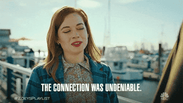 Zoey from "Zoey's Extraordinary Playlist" stands outdoors near a marina, with the text "The connection was undeniable" displayed. #ZoeysPlaylist