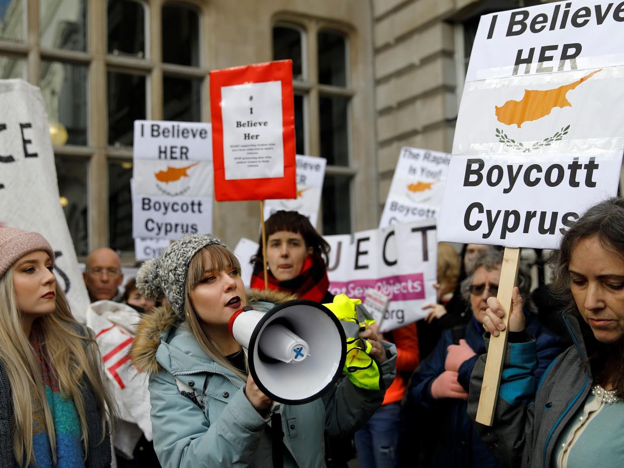 Demonstrators hold placards calling for a boycott on Cyprus as they protest in London: AFP